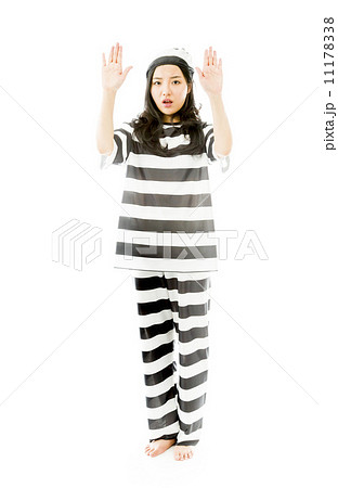 Young Asian woman making stop gesture sign from both hands in prisoners uniform 11178338