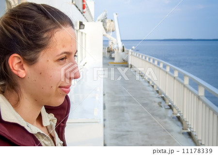 Mid adult woman enjoying in a ferry, Lake Huron, Georgian Bay, T 11178339