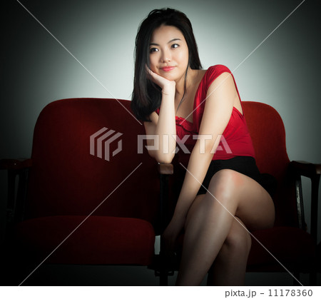 Attractive Asian girl 20s at the theatre isolate white backgroun Attractive Asian girl 20s at the theatre isolate white backgroun 11178360
