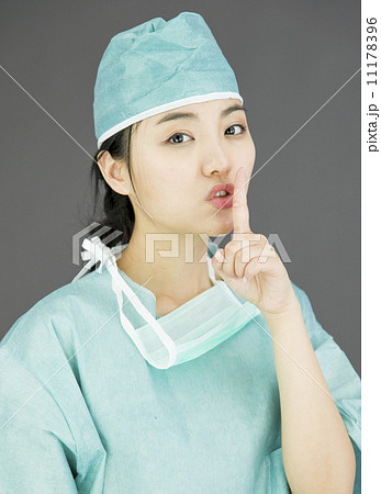 Asian female surgeon with finger on lips 11178396