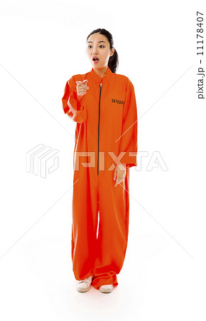 Young Asian woman scolding somebody in prisoners uniform 11178407