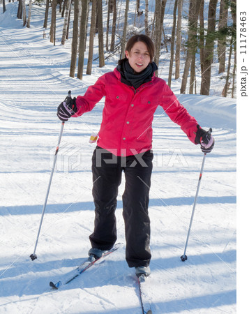 Mid adult woman skiing, Orangeville, Dufferin County, Ontario, C Mid adult woman skiing, Orangeville, Dufferin County, Ontario, C 11178463