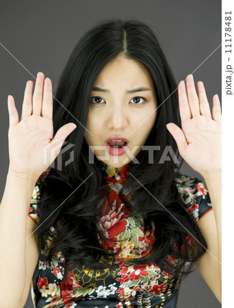 Asian young woman making stop gesture and showing stop 11178481