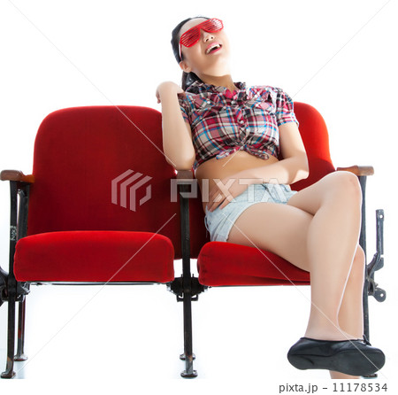 Attractive Asian girl 20s at the theatre isolate white backgroun 11178534