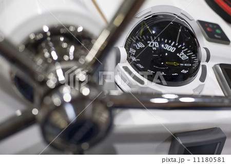 Steering wheel and compass of a speedboat 11180581