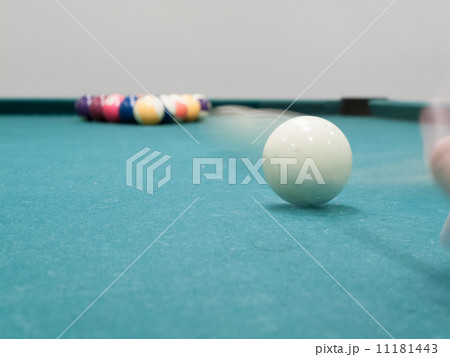 Cue ball in motion reaching toward pool balls Cue ball in motion reaching toward pool balls 11181443