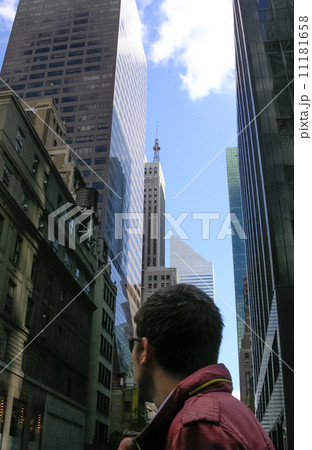 Low angle view of a man looking at building, New York City, New 11181658