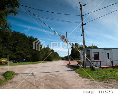 Open security barrier on the road, Quebec, Canada 11182531