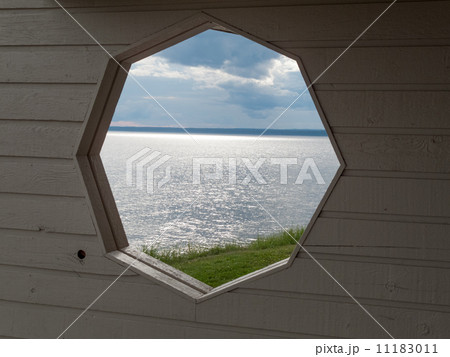 River viewed through a hole in wall, Quebec, Canada 11183011