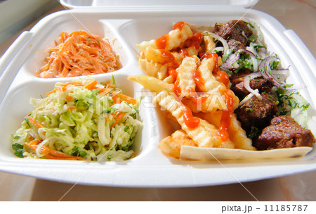 Polystyrene food foam tray with deep-fried potatoes,salads and m 11185787