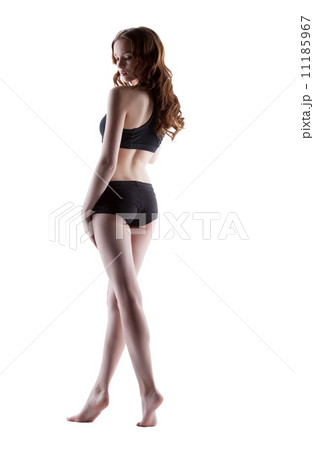 Thoughtful slender girl posing back to camera Thoughtful slender girl posing back to camera 11185967