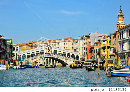 VENICE - March 28: Gondola at Rialto Bridge on March 28, 2012 in VENICE - March 28: Gondola at Rialto Bridge on March 28, 2012 in 11186131