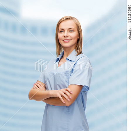 smiling female doctor or nurse smiling female doctor or nurse 11186696