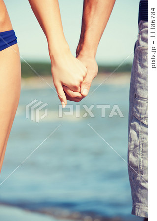 man and woman holding hands 11186784