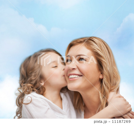 smiling mother and daughter hugging 11187269