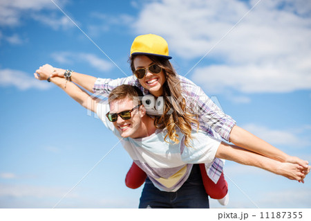 smiling teenagers in sunglasses having fun outside smiling teenagers in sunglasses having fun outside 11187355