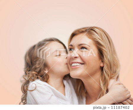 smiling mother and daughter hugging smiling mother and daughter hugging 11187402
