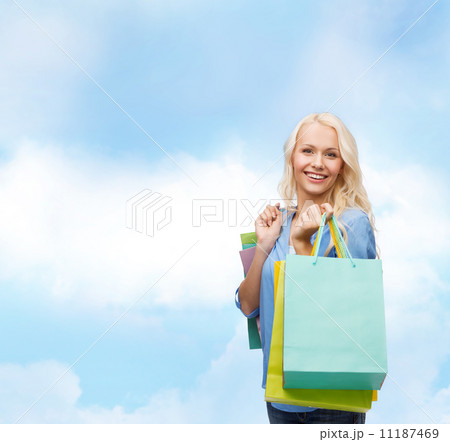 smiling woman with many shopping bags smiling woman with many shopping bags 11187469