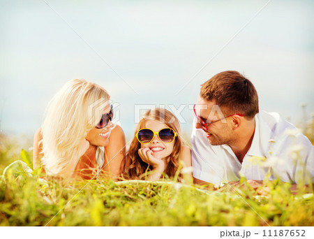 happy family with blue sky and green grass 11187652