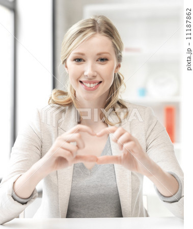 young woman showing heart sign 11187862