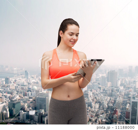 sporty woman with tablet pc computer sporty woman with tablet pc computer 11188000