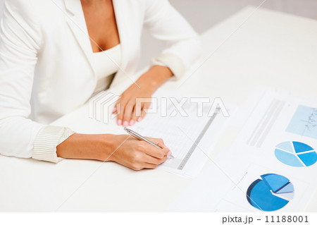businesswoman working with graphs in office businesswoman working with graphs in office 11188001