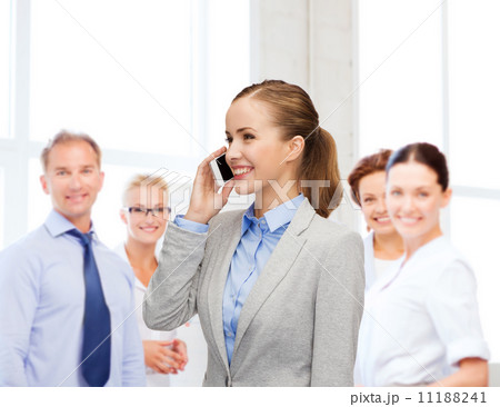 young smiling businesswoman with smartphone 11188241