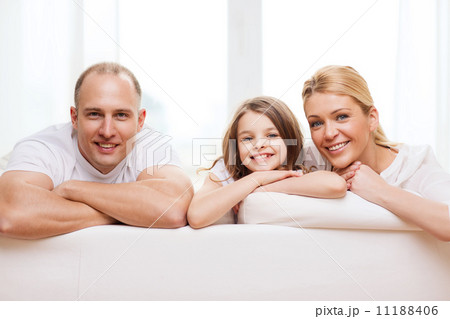 smiling parents and little girl at home 11188406