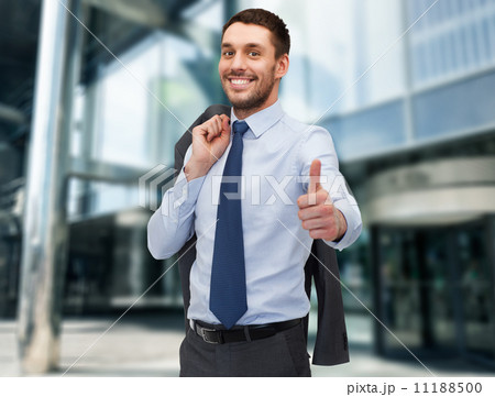 handsome buisnessman with jacket over shoulder 11188500