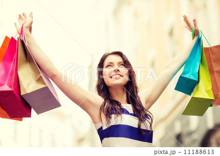 beautiful woman with shopping bags in the ctiy 11188613