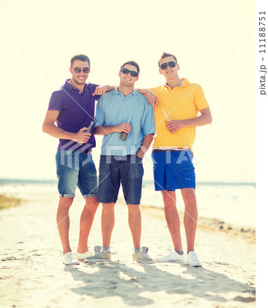 friends on the beach with bottles of drink friends on the beach with bottles of drink 11188751