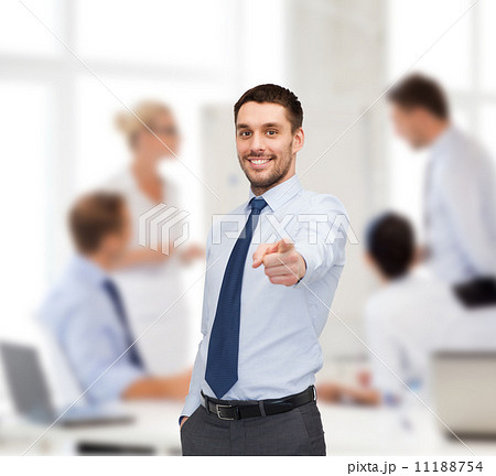 handsome businessman pointing finger at you handsome businessman pointing finger at you 11188754