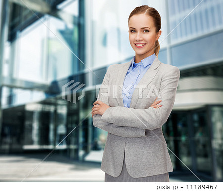 young smiling businesswoman with crossed arms young smiling businesswoman with crossed arms 11189467