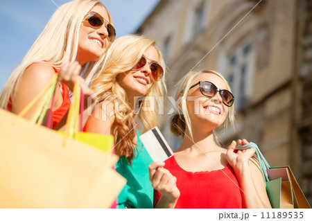 beautiful women with shopping bags in the ctiy 11189535