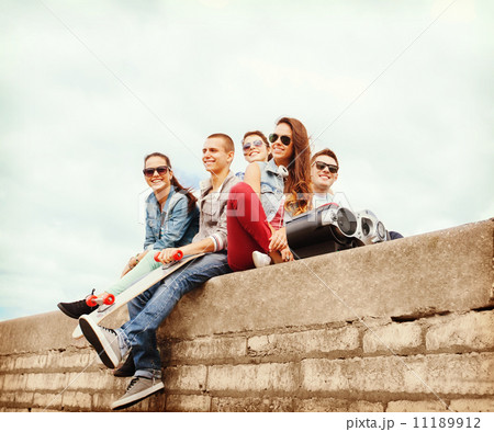 group of teenagers hanging outside group of teenagers hanging outside 11189912