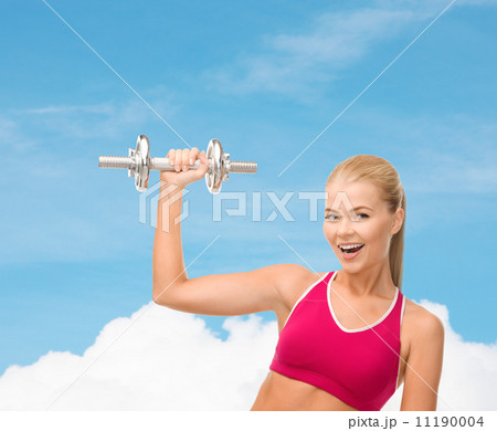 smiling woman with heavy steel dumbbell smiling woman with heavy steel dumbbell 11190004