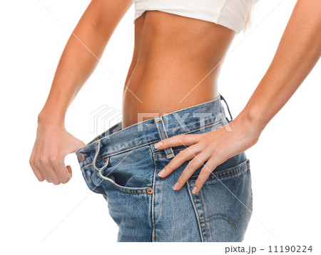 close up of female showing big jeans close up of female showing big jeans 11190224