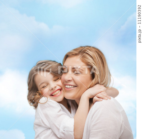 happy mother and daughter hugging happy mother and daughter hugging 11190392