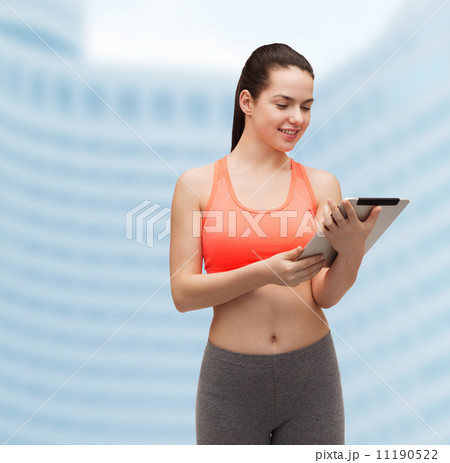 sporty woman with tablet pc computer 11190522