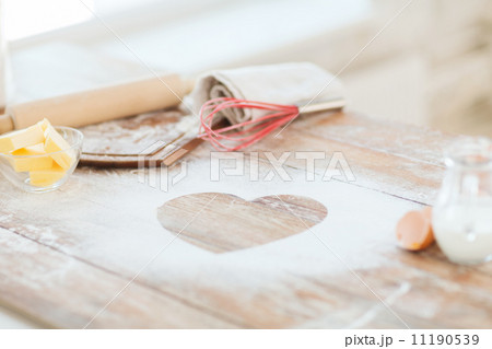 close up of heart of flour on wooden table at home close up of heart of flour on wooden table at home 11190539
