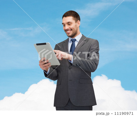 smiling businessman with tablet pc computer 11190971