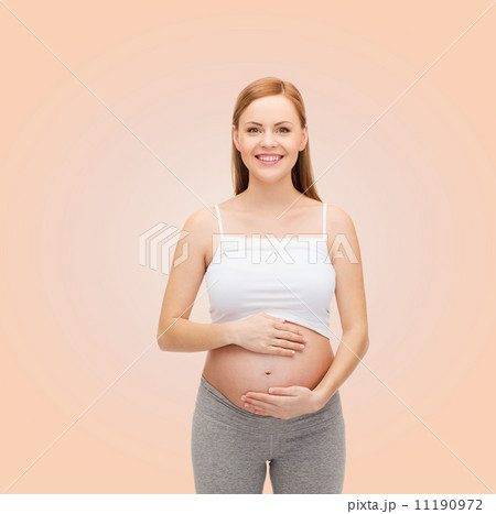 happy future mother touching her belly happy future mother touching her belly 11190972