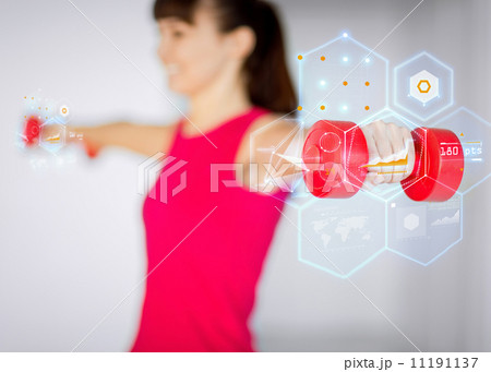 sporty woman hands with light red dumbbells 11191137