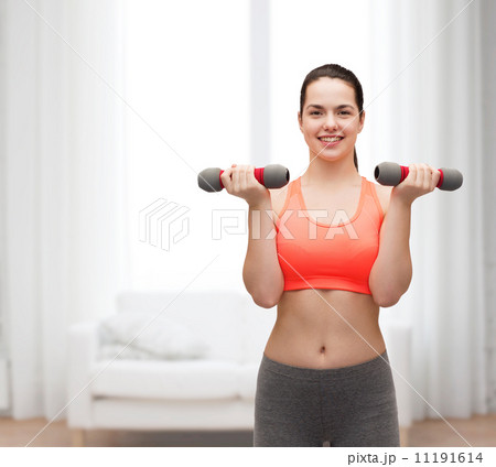 young sporty woman with light dumbbells young sporty woman with light dumbbells 11191614