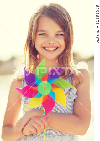 happy girl with colorful pinwheel toy happy girl with colorful pinwheel toy 11191669