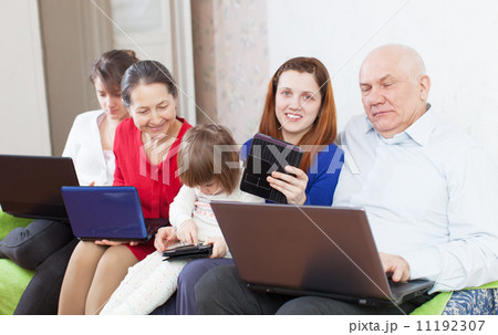 Happy family of with portable computers 11192307