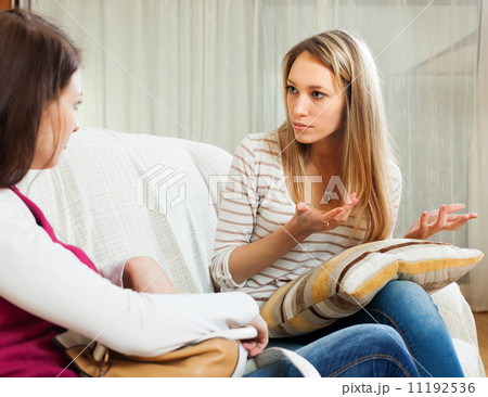 woman telling to friend about her problems 11192536