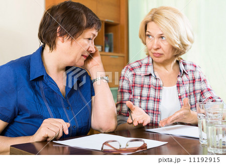 Two sad mature women with documents Two sad mature women with documents 11192915