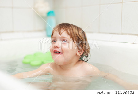 Happy two-year child bathes in bathtub Happy two-year child bathes in bathtub 11193402