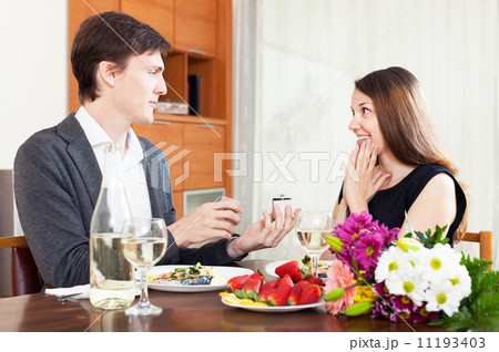 man is giving an engagement ring to his girlfriend man is giving an engagement ring to his girlfriend 11193403